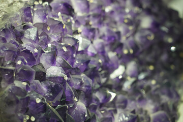 Raw amethyst geode with purple quartz crystals showing violet to lavender colors. Druzy formation...
