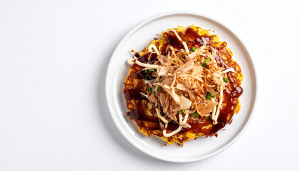 Japanese okonomiyaki served on a white plate placed on a white background