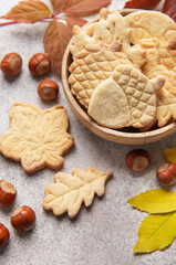 Autumn cookies with nuts and colorful leaves
