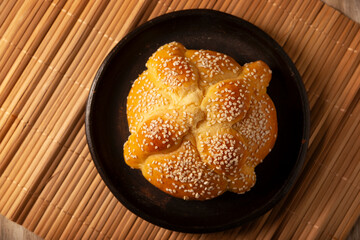 Pan de Muerto. Typical Mexican sweet bread that is consumed in the season of the day of the dead. It is a main element in the altars and offerings in the festivity of the day of the dead.