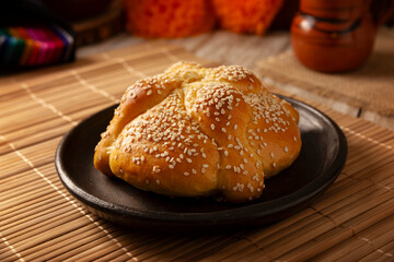 Pan de Muerto. Typical Mexican sweet bread that is consumed in the season of the day of the dead. It is a main element in the altars and offerings in the festivity of the day of the dead.