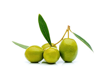 green olives with green leaves isolated on white background.