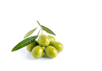 green olives with green leaves isolated on white background.
