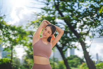 Obraz premium Beautiful asian female stretching arm for running exercise workout smooth armpit fitness woman wear sports outfit