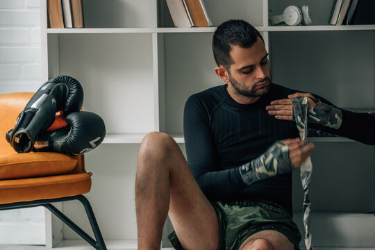 boxer putting on a boxing hand wrap