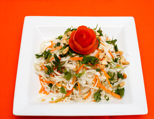 Fresh Asian Cabbage Salad with Peanuts and Tomato Garnish