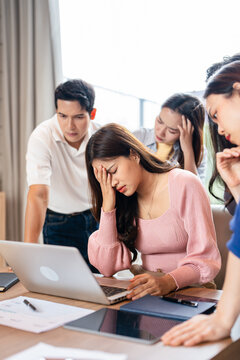 Tired business team are having a briefing meeting, can't find solution. Exhausted male and female employees fail a startup, upset about work troubles, unsuccess and overwork concept.