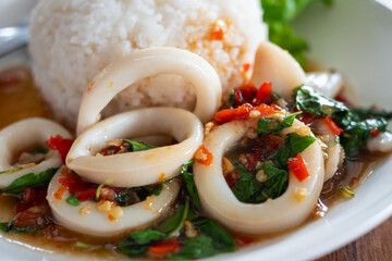 Delicious stir-fried squid dish with rice thai cuisine food restaurant close-up flavor explosion