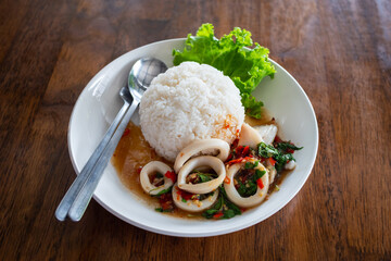 Culinary delight seafood stir-fry with rice in a cozy asian dining experience