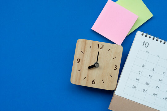 close up of calendar on the blue table background, planning for business meeting or travel planning concept