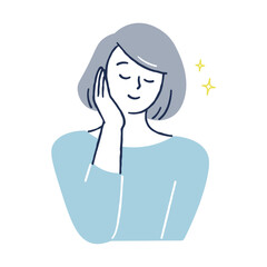 頬に手を当ててほほえむ女性