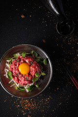 Exquisite Beef Tartare with Fresh Egg Yolk and Microgreens