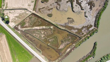 Obraz premium Aerial View Of Wetland Area In Farm Land For Conservation And Agriculture Irrigation Project