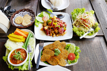 Delicious traditional food of Thailand on wooden table