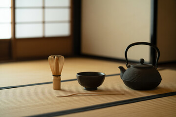 茶道具一式を整然と並べた茶室の一角　Japanese tea utensils (tea whisk, bowl, kettle) neatly arranged on tatami in a traditional tea room