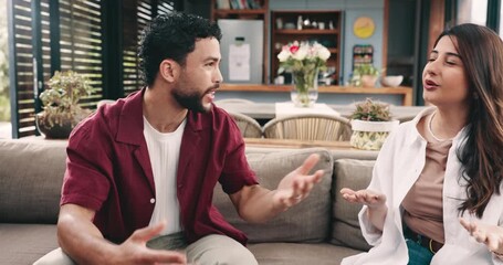 Couple, fight and unhappy with betrayal, lounge and denying cheating allegation in home or conflict. Angry, man and woman with relationship problems, shout and frustrated with infidelity accusations