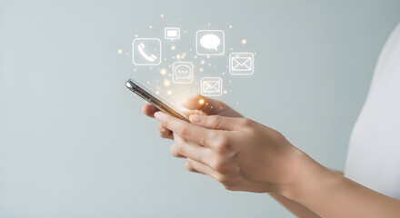 Person holding smartphone with digital icons floating above screen