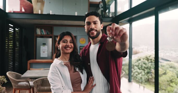 Couple, keys and face in new house with smile, mortgage or hug with moving for property investment. Man, woman and partner with real estate agent sale, rent and relocation at apartment in Colombia
