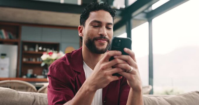 Social media, thinking or happy man with phone on sofa, post caption and update message on network app. Contemplation, comment or person with mobile for communication, reply ideas and texting in home