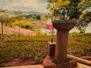 Fototapeta premium Outdoor Hand Wash Station Near Lake Park Landscape
