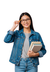 Portrait of a young Asian woman standing against a pink background, smiling while holding a stack of books in one arm and a pencil near her temple with the other hand. She wears glasses.