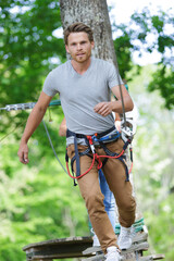 Obraz premium man at the extreme rope park