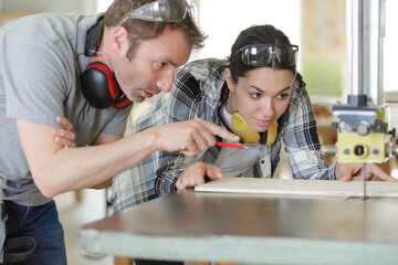 senior as a carpenter master and apprentices