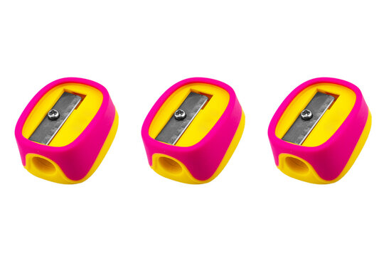 Pencil sharpener isolated on a white background. Three Manual purple pencil sharpener