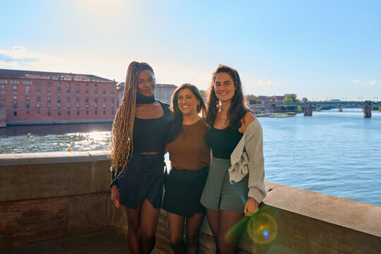 Three young diverse women enjoying friendship in toulouse - Powered by Adobe