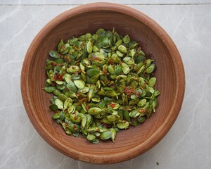 Pencok Katel: Spicy Sundanese Soybean Leaf Raw Salad in Clay Plate