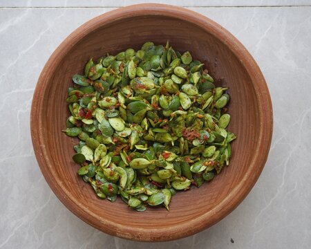 Pencok Katel: Spicy Sundanese Soybean Leaf Raw Salad in Clay Plate