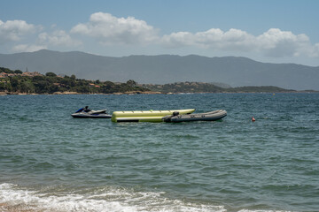 Obraz premium Spectacular view Golf at Sagone Corsica France beautyful sand Beach boats mountain village Tourism and vacations concept