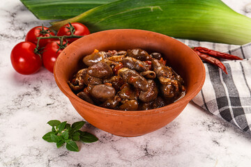 Baked chicken hearts with vegetables