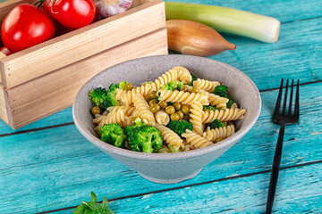 Italian vegan pasta fusilli with broccoli