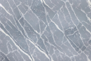 Gray marble texture. Surface natural gray marble with white color veins, background, close-up, high resolution.