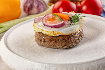 Beefsteak chop with roasted egg