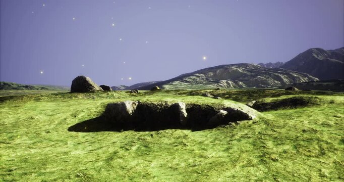 Gentle hills roll in vibrant green hues as towering mountains loom under a twilight sky. Stars begin to twinkle, casting a magical glow across the serene landscape.