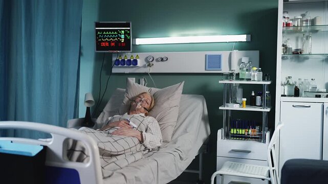 Senior female patient in oxygen mask lying in bed with unstable vital signs