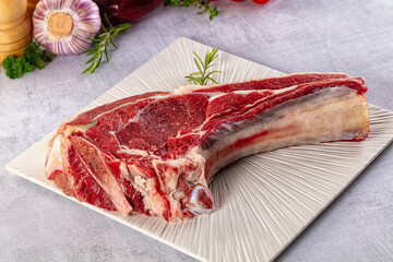 Raw prime beef steak with bone