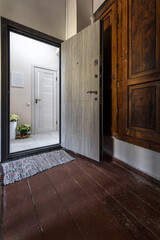 Open Door Entrance with Wooden Floor and Bright Hallway