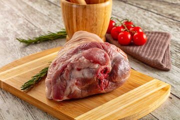 Raw pork knuckle over board