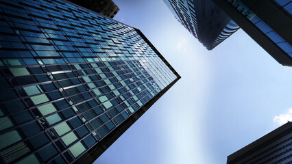Modern urban skyscrapers towering against clear blue sky in a metropolitan city