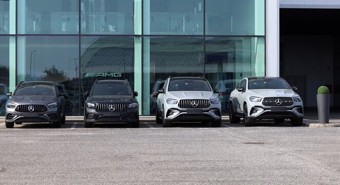 Tavagnacco, Italy. October 19, 2025. Different models of new Mercedes Benz  SUV on display in front of the dealer facade of the german automaker.