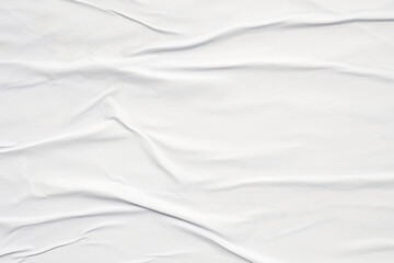 white crumpled and creased glued wrinkled paper poster texture background