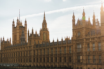 The beauty and intricate details of the Palace of Westminster in daytime, England, a must-visit historic landmark and popular tourist attraction.