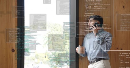 Developer holding coffee mug and smartphone by office window with code overlays, copy space