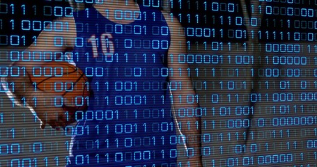 Male wearing blue jersey number 10 holding basketball standing in gym, with binary code overlay