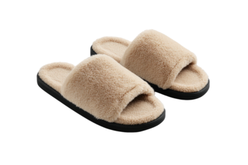 Fuzzy slippers beige uppers, dark soles, on a dark background