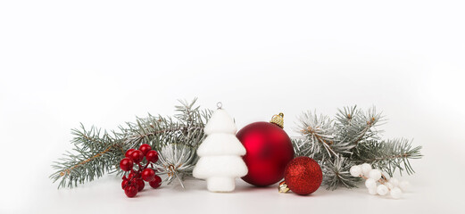 Christmas card with fir branches and Christmas decorations. Copy space