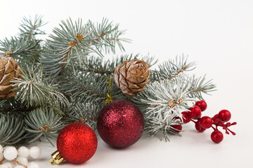 Christmas card with fir branches and Christmas decorations. Copy space